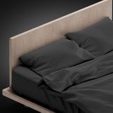 blank-black-bed-with-pillows-isolated