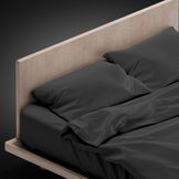 blank-black-bed-with-pillows-isolated